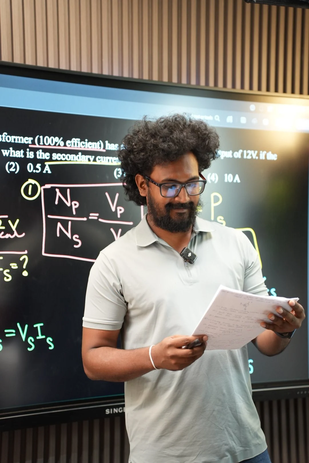 Sahan I Herath teaching a science lesson in the classroom